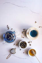Blue Butterfly Pea Flower Tea On White Marble Background Top View Flatlay, With Negative Copy Space.