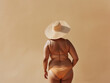 © Boadicea - Plus size woman in bikini and hat