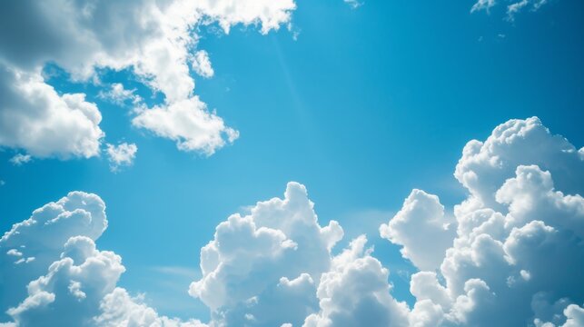 Fluffy white clouds on blue sky