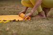 © Natalje Dietrich - A middle-aged woman is doing yoga in the park