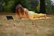 © Natalje Dietrich - A middle-aged woman is doing yoga in the park