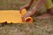 © Natalje Dietrich - A middle-aged woman is doing yoga in the park
