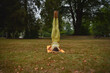 © Natalje Dietrich - A middle-aged woman is doing yoga in the park