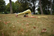 © Natalje Dietrich - A middle-aged woman is doing yoga in the park