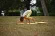 © Natalje Dietrich - A middle-aged woman is doing yoga in the park
