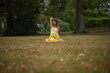 © Natalje Dietrich - A middle-aged woman is doing yoga in the park