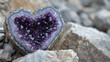 Heart-shaped amethyst geode inside a granite rock.