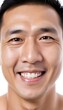 © Antonio Giordano - Closeup portrait of happy asian man face, isolated on white background with copy space.