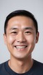 © Antonio Giordano - Closeup portrait of happy asian man face, isolated on white background with copy space.