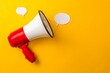 Megaphone with speech bubble on yellow background, marketing concept