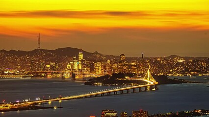 Wall Mural - San Francisco Bay Bridge Oakland California - sunset to nighttime time lapse 