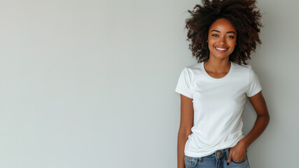 Afro woman wear white t-shirt smile isolated on grey background