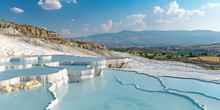 Mineral Rich Baby Blue Thermal Waters In White Travertine Terraces On A Hillside In Pamukkale, Turkey. Outdoors Spa In Nature, Travel Destination, Relaxation And Calmness Landscape Background