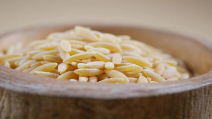 Poster - Closeup of brown long rice in a bowl on table .