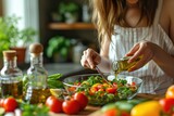 Fototapeta  - Woman pouring olive oil in to the vegetable salad, healthy eating.