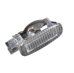 A  transparent plastic shade for illuminating the interior on a white isolated background in a photo studio - spare parts for repairing a car interior or for sale in a auto service.