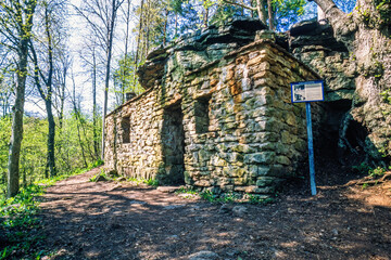 Sticker - Old stone cottage by a cave at Kinnekulle in Sweden