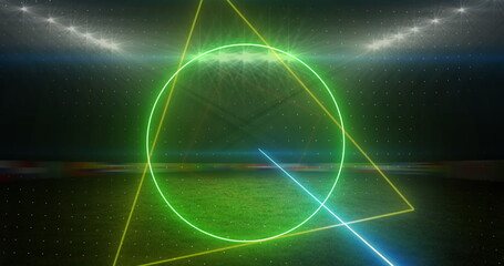 Poster - Image of rotating neon shapes and lights over floodlit sports field