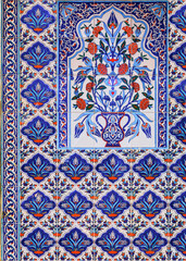 Wall Mural - Ornate blue and red handmade Turkish Iznik mosaic tiles with floral Islamic patterns in a traditional Ottoman style in Istanbul, Turkey