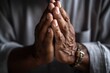 closeup shot of a man holding his palms together in prayer