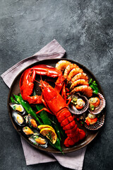 Poster - Big red lobster on plate with shrimp and mussels with lemon, souce pesto and bread. Seafood concept