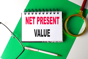 Poster - NET PRESENT VALUE text on notebook on green paper