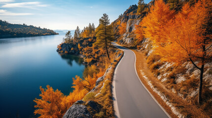 Poster - Aerial view of rural road with red car in yellow and orange autumn forest with blue lake