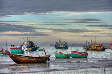 Mui Ne Vietnam,F ishing village in Mui Ne, Vietnam, Southeast Asia, Fisherboats and lokal market, early morning