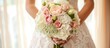The bride holds a luxurious white wedding bouquet in pastel shades with roses, carnations, and hydrangeas.