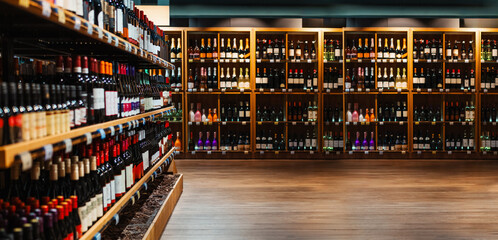 Composite image of liquor store. Wine and champaign bottles on shelves in liquor store. 