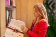 © czamfir - business woman in the Archive looking for something through the files.