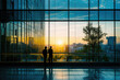 © ttonaorh - Silhouette of business people standing in office building with sunlight