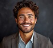 © hakule - Portrait of handsome smiling businessman with suit in professional studio background