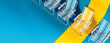 © hd3dsh - Beach chairs with one yellow spot marking the right place for your summer vacation. Summer travel, concept on blue background with copy space. 3D Rendering, 3D Illustration