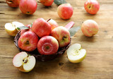 Fototapeta Tulipany - organic red apples on wooden table
