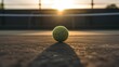 AI generated illustration of A brightly lit yellow tennis ball resting on a green grass court