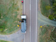 © Austockphoto - Aerial photo of garbage truck emptying bins in rural location