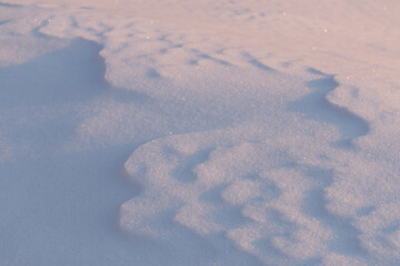 Wall Mural - blue pink layered snow surface in morning sunlight natural pattern texture background