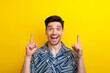 canvas print picture - Photo of impressed ecstatic man with bristle dressed blue clothes indicating at poster empty space isolated on yellow color background