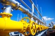 © Ilham - Industrial yellow pipelines and valves on blue sky background