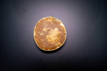 Palm jaggery isolated on black background