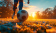 Dynamic close-up of a soccer ball being kicked on a frosty field at sunset, capturing the action and energy of outdoor sports in cold weather
