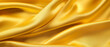 Silky smooth golden fabric with elegant folds