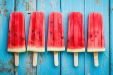 Watermelon Slice Popsicles On A Blue Rustic Wood Background.