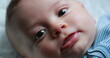 © Marco - Happy newborn baby infant face closeup of expression