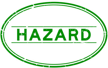 Sticker - Grunge green hazard word oval rubber seal stamp on white background