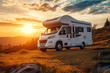 © Ivan - A camper standing in a meadow in the mountains with a beautiful setting sun, holiday theme