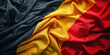 Wavy fabric in colors of the belgian flag, background, wallpaper, backdrop