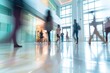 Bright business workplace with people walking in blurred motion in modern office building