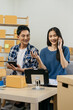 © NINENII - Couple start up small business owner at workplace. small business entrepreneur SME or freelance asian woman working with box at home.